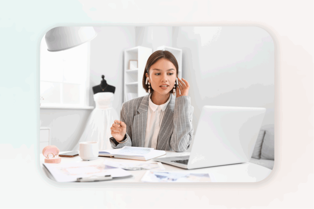 Female wedding planner working on laptop while designing her digital product.