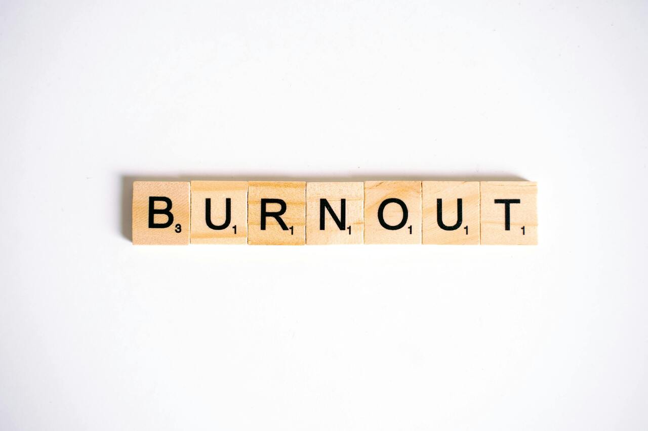 Creator burnout represented by scrabble tiles