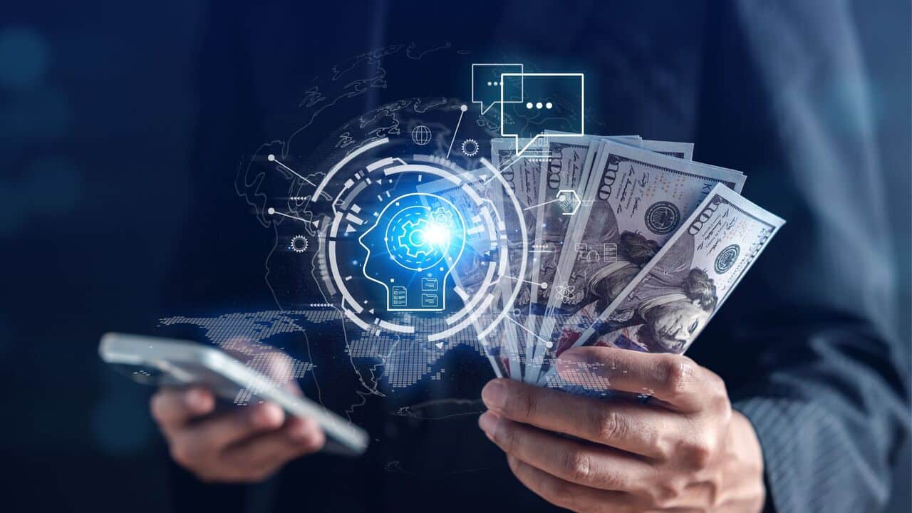 Person holding money and phone