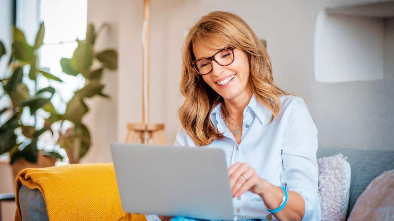 Woman smiling with her laptop