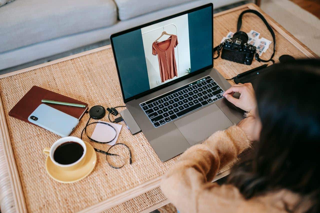 Ecommerce seller managing organic marketing from laptop