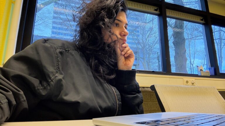 Laura Mantilla Vargas at her laptop while working on a marketing agent.